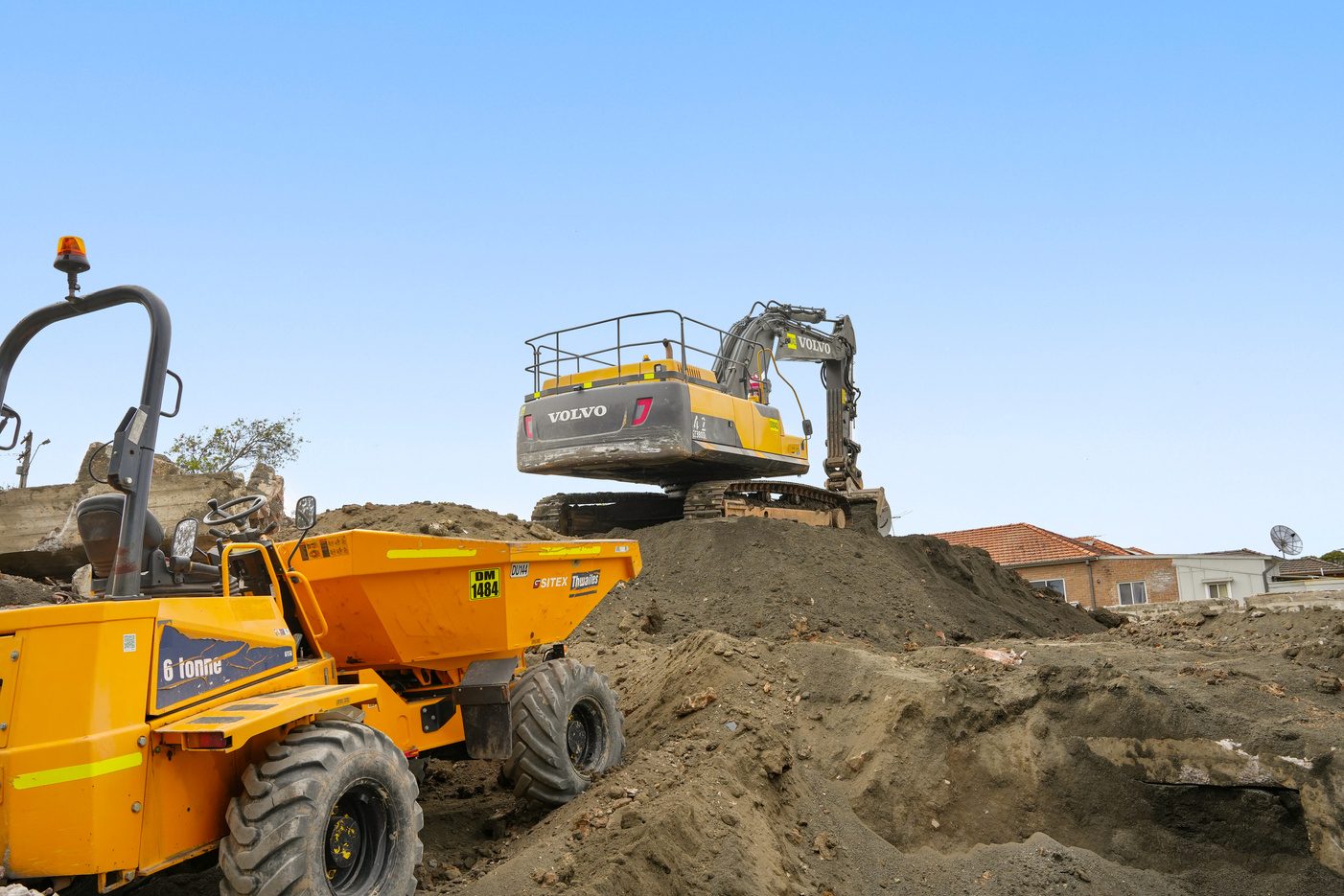Construction crane lifting equipment on site, high angle