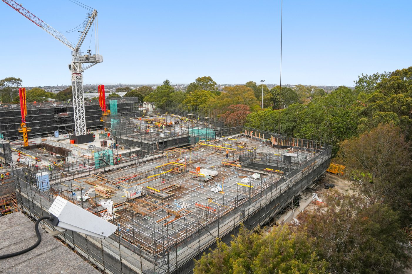 Construction workers on scaffolding at a mid-rise building