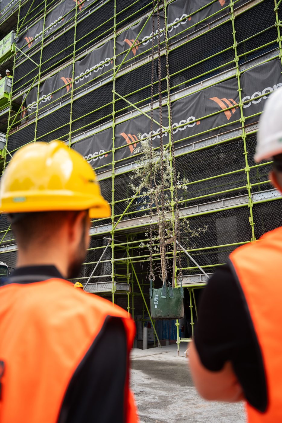 Site manager on a phone call at a residential construction site