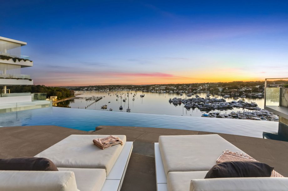 Dusk exterior with pool and harbour bridge in the distance