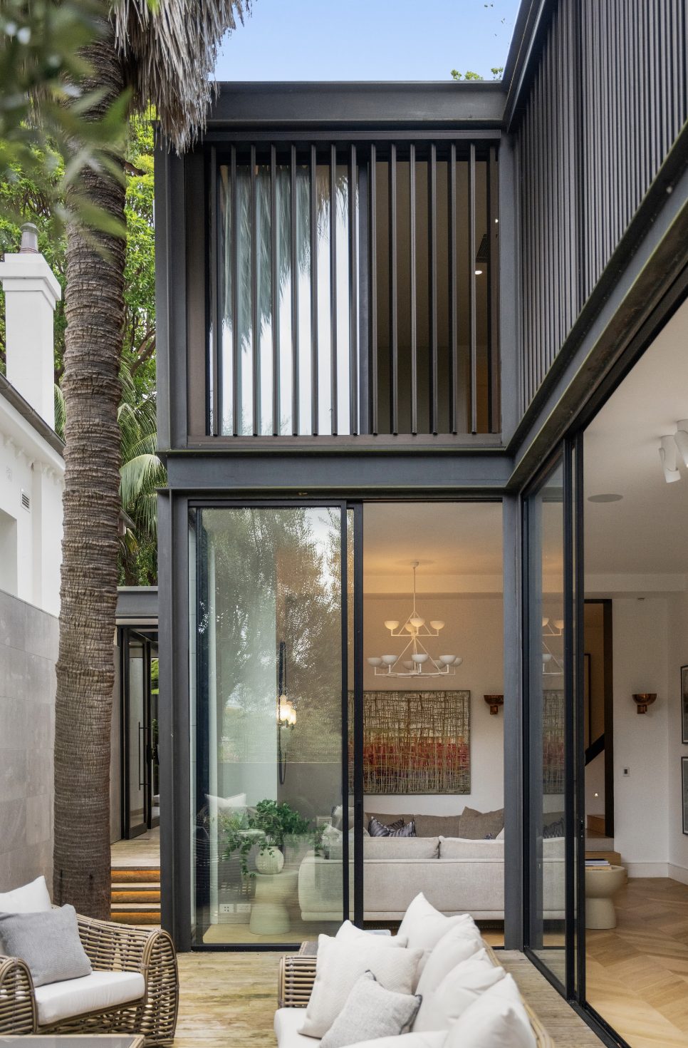 Black-framed two storey courtyard extension exterior detail