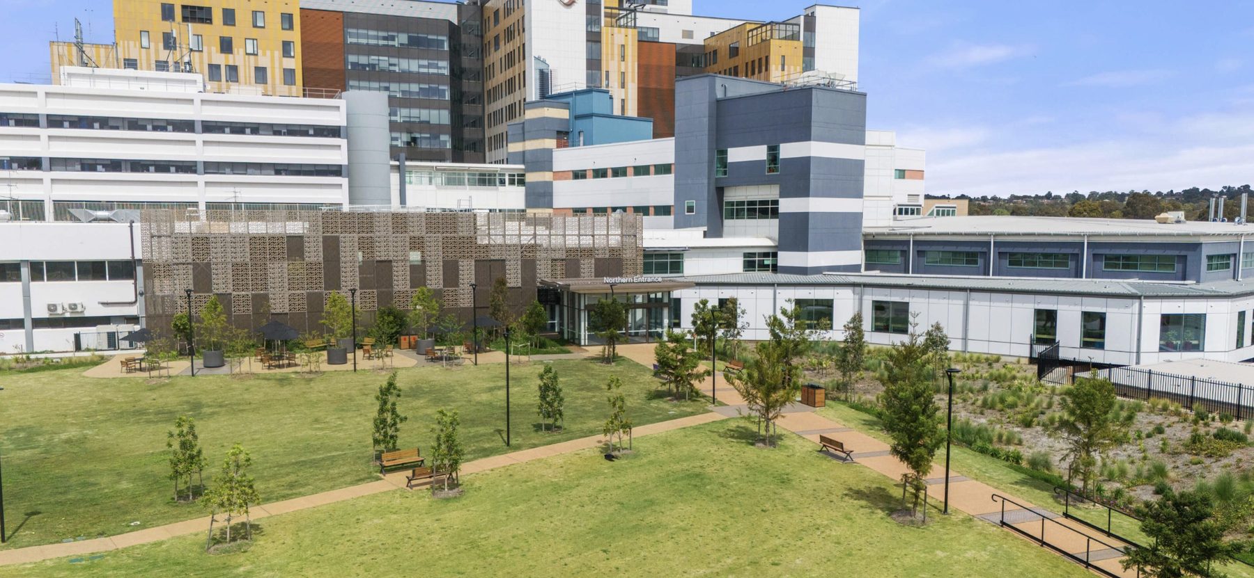 Wide exterior view of a hospital campus building