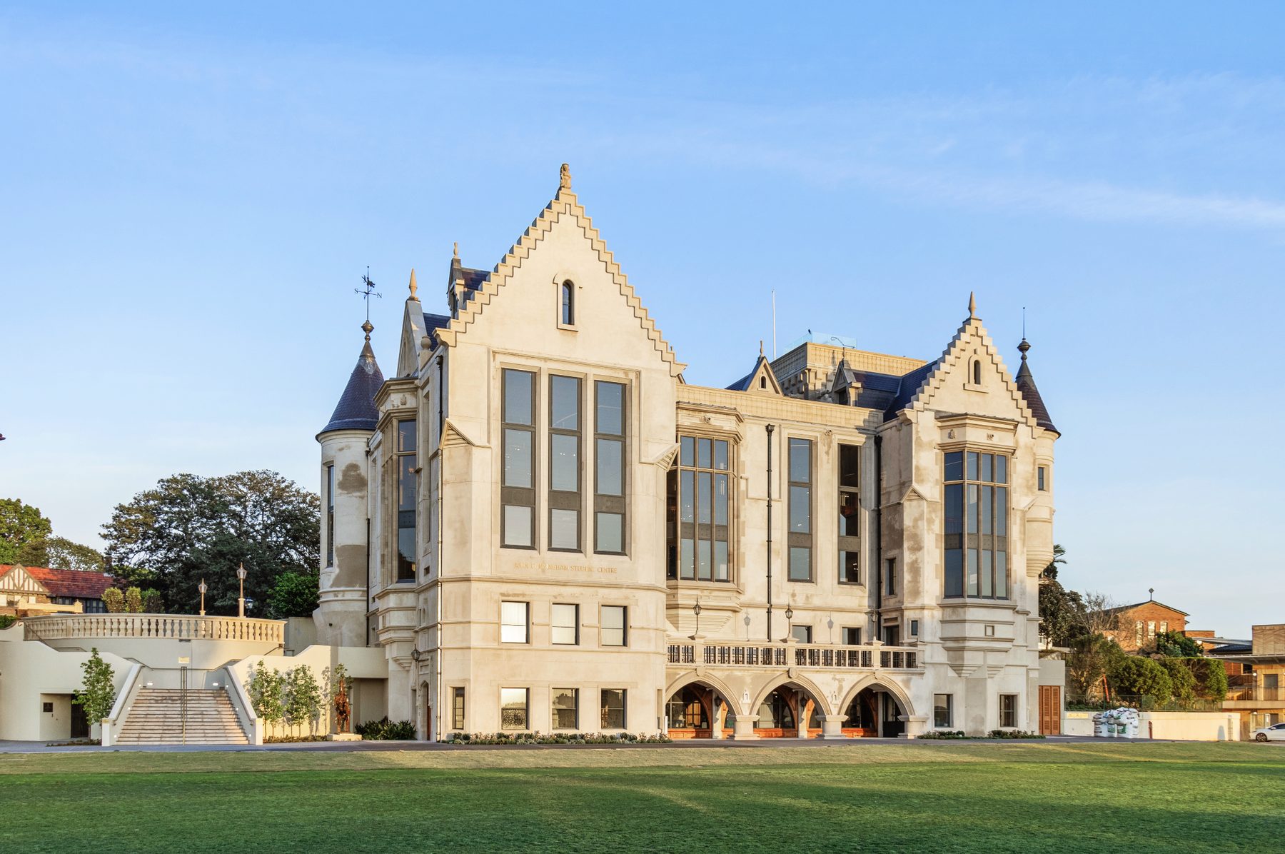 Daytime facade of a heritage-style stone student centre building