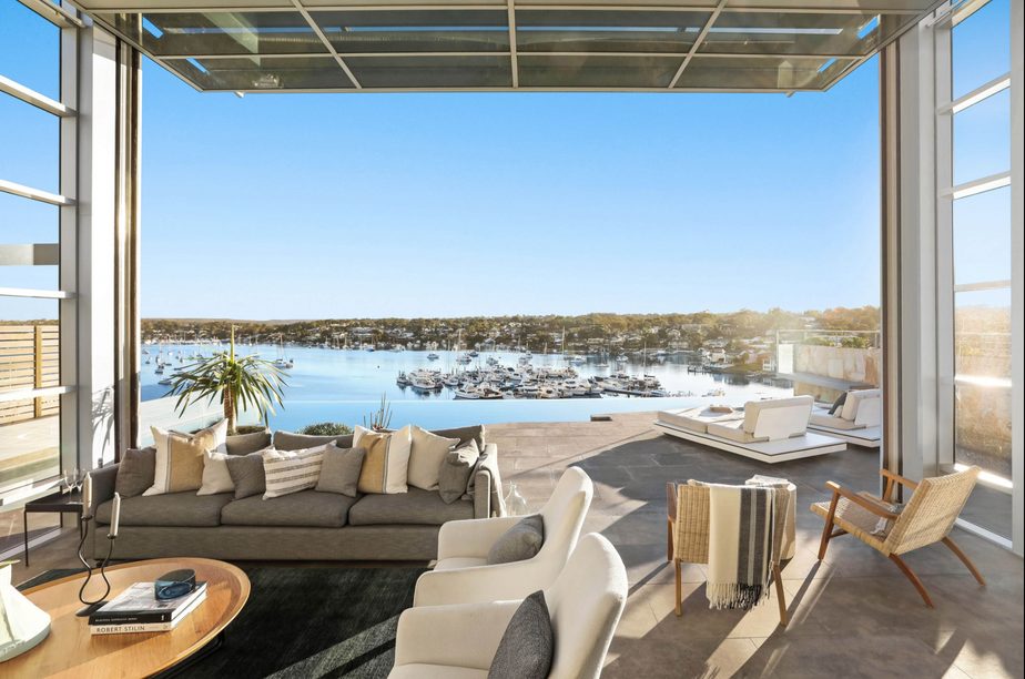 Living room open to a harbour view