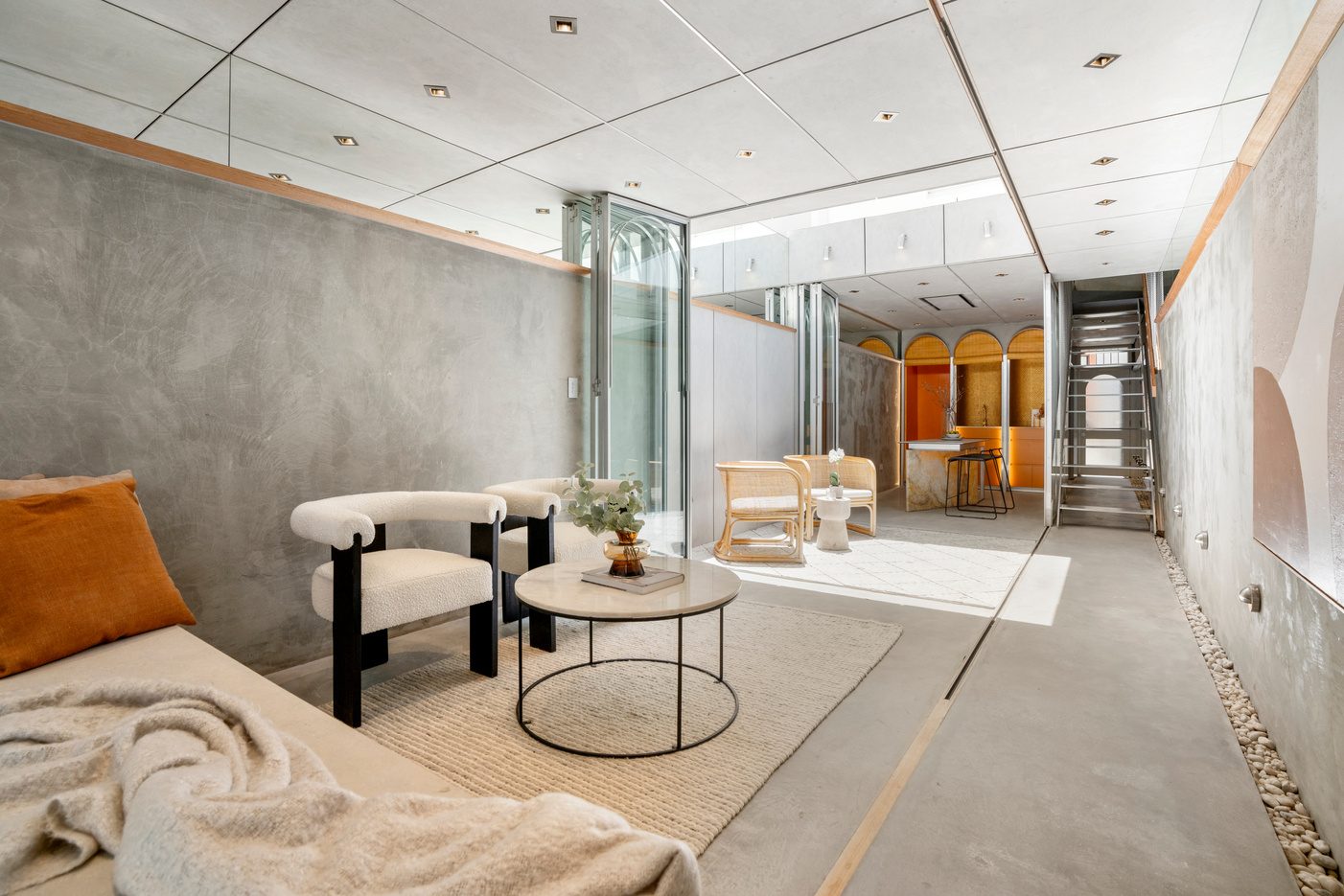 Concrete lounge area with round coffee table